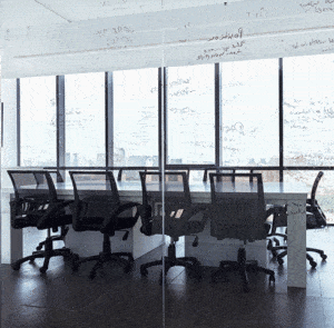 empty conference room with writing on clear glass