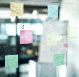 post it notes on clear board