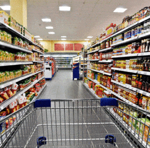 shopping cart being pushed down an isle