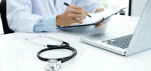 healthcare professional filling out chart