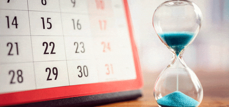 photo of calendar and sand in a glass for Getting Your Drug Approved article