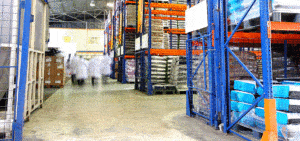 distribution warehouse with employees walking in the background