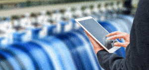 photo of a person using a tablet at a factory for the Reengineering of Processes case study