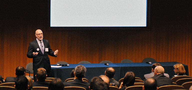 C. Richard Panico speaking at an award meeting